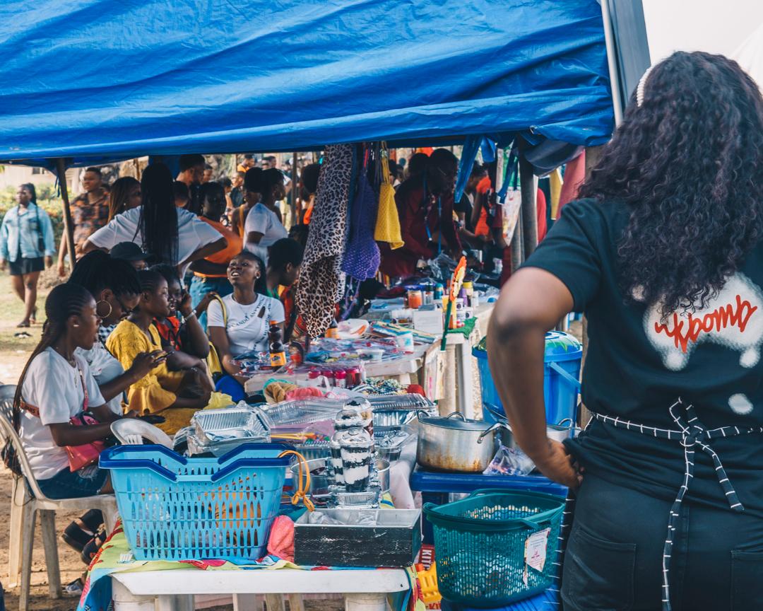 Vendors and shoppers at a MedFest market stall